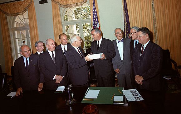 The Warren Commission presents its report to President Johnson